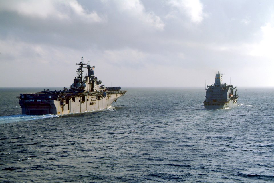 US Navy 060225-N-4772B-010 The amphibious assault ship USS Essex (LHD 2), left, navigates alongside the Military Sealift Command (MSC) fleet replenishment oiler USNS Yukon (T-AO 202)