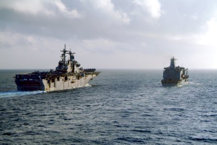 US Navy 060225-N-4772B-010 The amphibious assault ship USS Essex (LHD 2), left, navigates alongside the Military Sealift Command (MSC) fleet replenishment oiler USNS Yukon (T-AO 202)