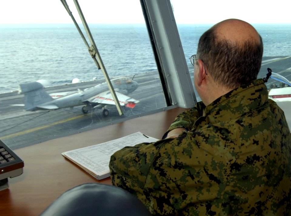 US Navy 060130-N-2568S-142 Secretary of the Navy (SECNAV), the Honorable Dr. Donald C. Winter watches as aircraft land aboard the Nimitz-class aircraft carrier USS Theodore Roosevelt (CVN 71)