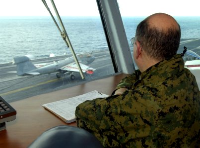 US Navy 060130-N-2568S-142 Secretary of the Navy (SECNAV), the Honorable Dr. Donald C. Winter watches as aircraft land aboard the Nimitz-class aircraft carrier USS Theodore Roosevelt (CVN 71)