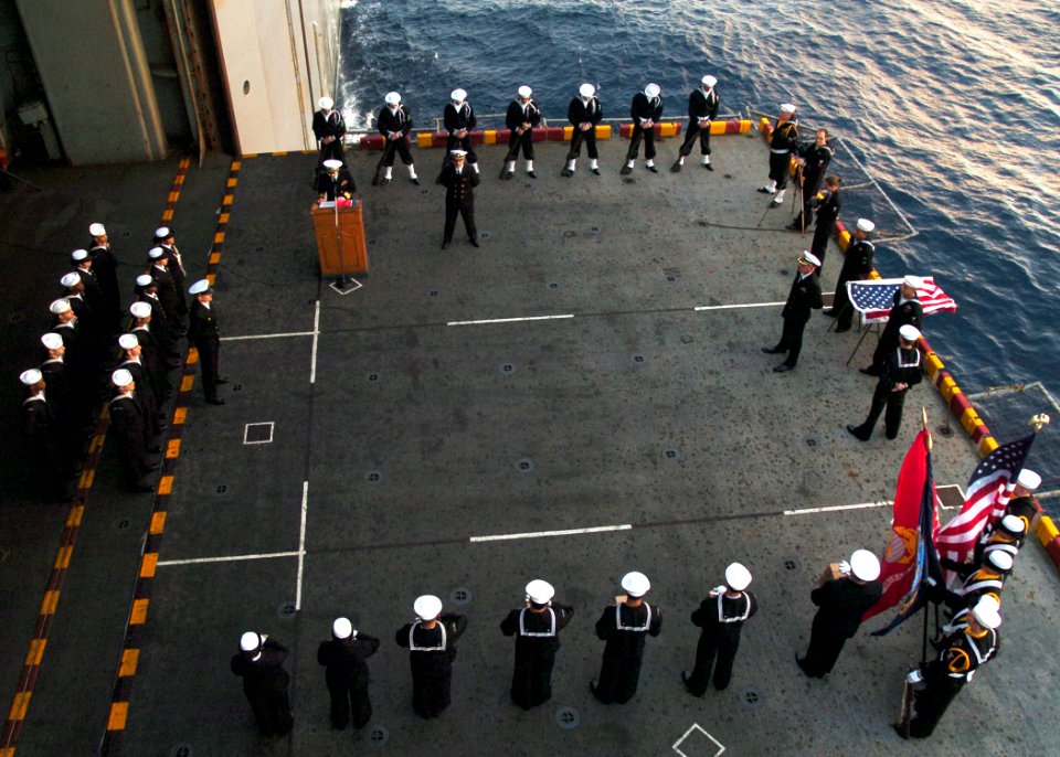 US Navy 060213-N-7217H-003 The crew of the amphibious assault ship USS Tarawa (LHA 1) conducts a burial at sea for seven veterans on the port elevator