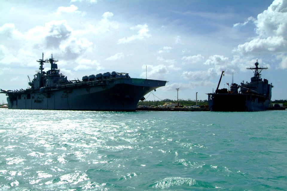 US Navy 060209-N-4772B-502 The amphibious assault ship USS Essex (LHD 2) and the amphibious dock landing ship USS Harpers Ferry (LSD 49) moored together in Guam to load elements of the 31st Marine Expeditionary Unit (MEU)