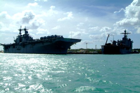 US Navy 060209-N-4772B-502 The amphibious assault ship USS Essex (LHD 2) and the amphibious dock landing ship USS Harpers Ferry (LSD 49) moored together in Guam to load elements of the 31st Marine Expeditionary Unit (MEU)