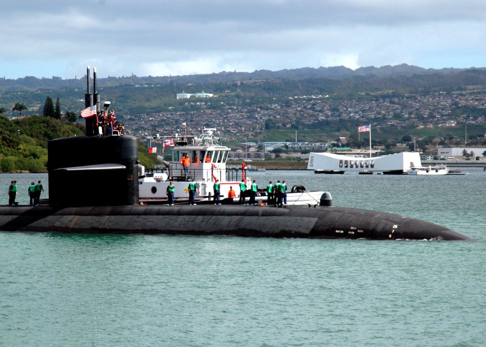 US Navy 060210-N-3019M-005 The Los Angeles-class fast attack submarine USS Louisville (SSN 724) passes the USS Arizona Memorial as it enters Pearl Harbor