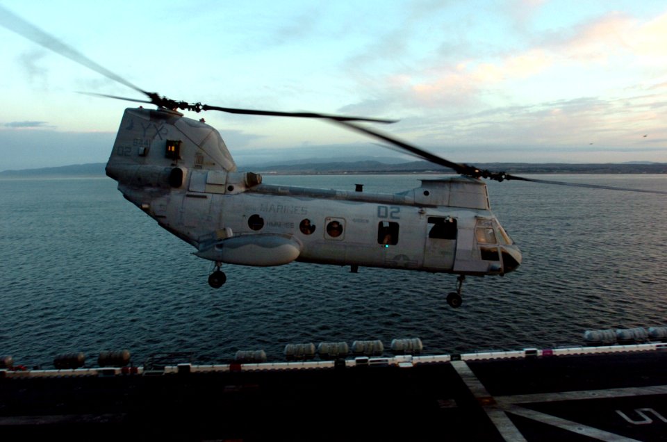 US Navy 060125-N-9866B-047 A CH-46E Sea Knight helicopter, assigned to the Sea Elks of Marine Medium Helicopter Squadron One Six Six (HMM-166) takes off from the flight deck of the amphibious assault ship USS Peleliu (LHA 5)