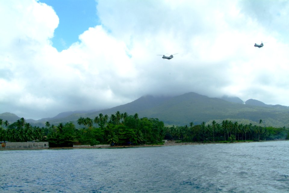 US Navy 060220-N-4772B-197 A pair of U.S. Marine Corps CH-46E Sea Knight helicopters from combat air elements of the 31st Marine Expeditionary Unit (MEU) provide equipment and personnel to aid in local relief efforts for victim
