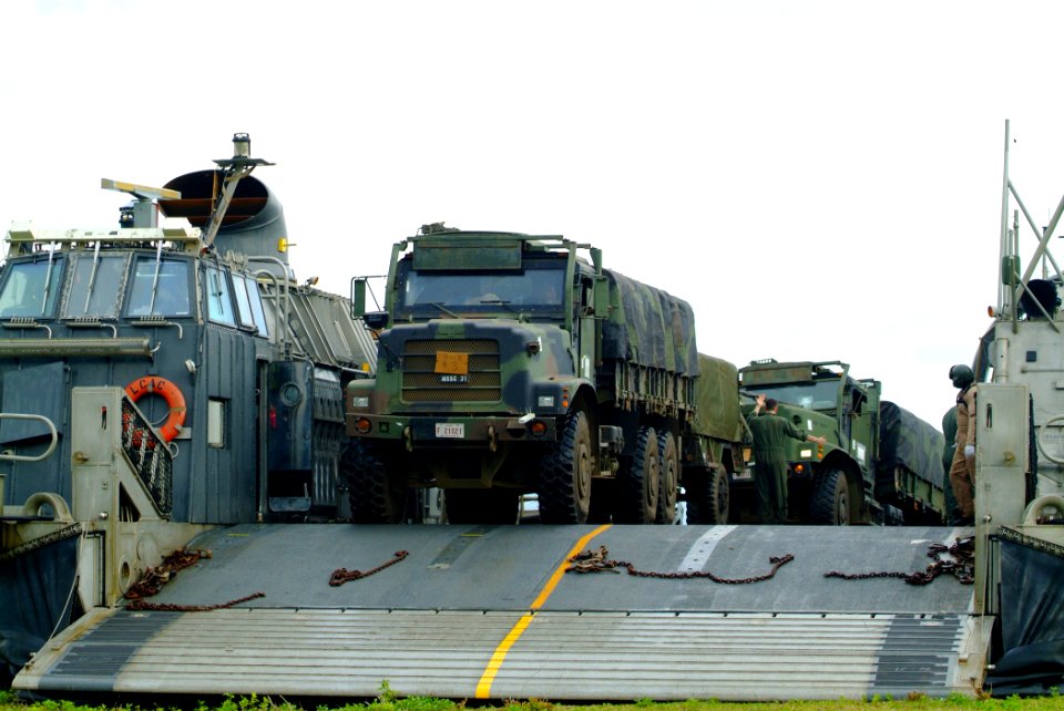 US Navy 060303-N-4772B-028 Marines assigned to the 31st Marine Service Support Group (MSSG) load equipment on a Landing Craft, Air Cushion (LCAC) on the island of Jolo, before heading out toward the amphibious dock landing ship