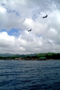 US Navy 060220-N-4772B-198 A pair of U.S. Marine Corps CH-46E Sea Knight helicopters from combat air elements of the 31st Marine Expeditionary Unit (MEU) provide equipment and personnel to aid in local relief efforts for victim