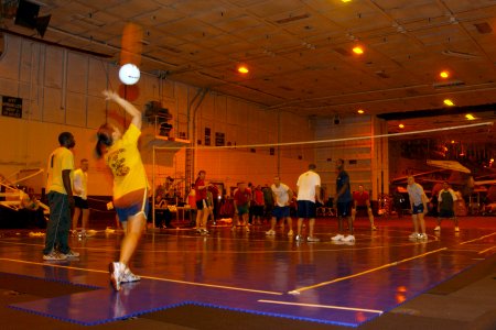 US Navy 060209-N-0685C-002 Sailors aboard the Nimitz-class aircraft carrier USS Theodore Roosevelt (CVN 71) compete in a Morale, Welfare and Recreation (MWR) volleyball tournament in the ship's hangar bay