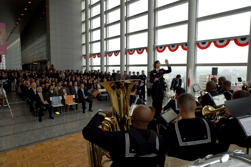 US Navy 060131-N-1194D-002 Chief Musician Roberta Haworth directs the Seventh Fleet Band's Far East Edition during a goodwill concert