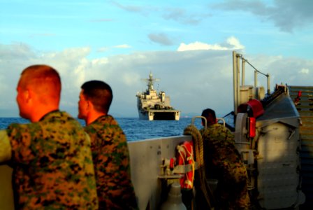 US Navy 060222-N-4772B-207 U.S. Marines assigned to the 31st Marine Expeditionary Unit (MEU) watch as Landing Craft Utility (LCU) 1627 approaches the amphibious dock landing ship USS Harpers Ferry (LSD 49)