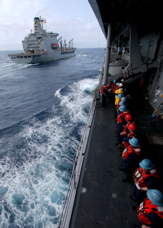 US Navy 060318-N-7526R-080 Amphibious command ship USS Blue Ridge (LCC 19) Sailors line the rails in preparation for a replenishment at sea