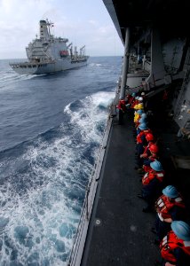 US Navy 060318-N-7526R-080 Amphibious command ship USS Blue Ridge (LCC 19) Sailors line the rails in preparation for a replenishment at sea