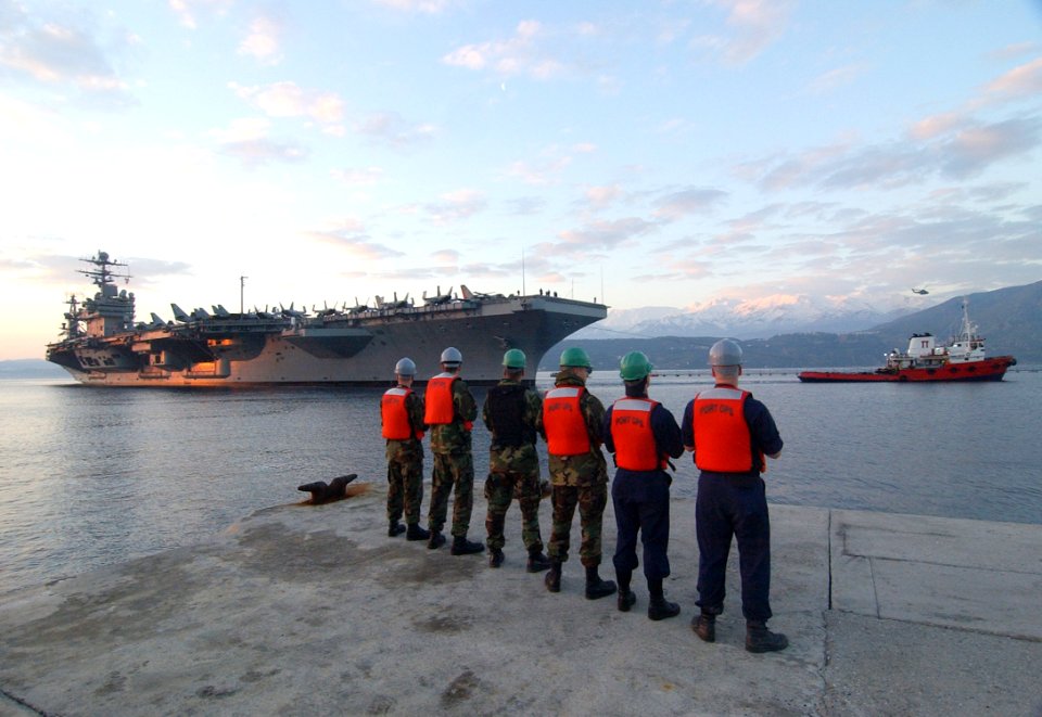 US Navy 060222-N-0780F-004 Sailors assigned to U.S. Naval Support Activity Souda Bay standby to handle mooring lines as the Nimitz-class aircraft carrier USS Theodore Roosevelt (CVN 71) arrives for a logistics stop on the Greek