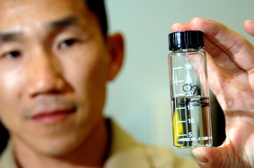 US Navy 060207-N-3019M-004 Lt. Kyle Lim, industrial hygiene officer assigned to Navy Environmental and Preventative Medicine Unit Six (NEPMU-6), prepares to test a water sample for contaminants