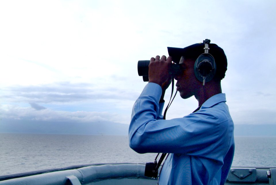 US Navy 060218-N-4772B-004 Seaman Levi Brunette stands watch on the bridge wing as the landing ship USS Harpers Ferry (LSD 49)