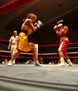 US Navy 060208-N-1577S-073 Information Systems Technician 2nd Class Triva Pino, left, assigned to the guided missile cruiser USS Port Royal (CG 73), won the 2006 U.S. Armed Forces Boxing Championship