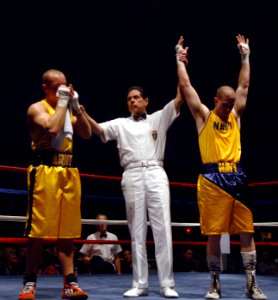 US Navy 060210-N-2653P-049 Aviation Warfare Systems Operator 2nd Class Adam Fusinato, assigned to the Red Lions of Helicopter Squadron One Five (HS-15) defeated Army 1st Lt. Boyd Melson in the opening round of a four-round fina
