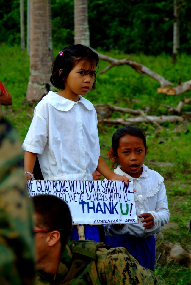 US Navy 060303-N-4772B-123 Townspeople from the local village of Tiptipon gather near the beach to bid farewell to U.S. service members assigned to the 31st Marine Service Support Group (MSSG) following a Civil Action Project i