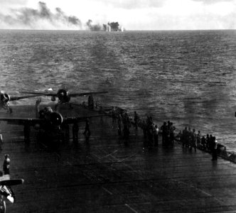 USS Fanshaw Bay (CVE-70) is straddled by shells during the Battle off Samar, 25 October 1944 (80-G-287492)