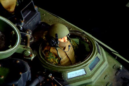 US Navy 060329-N-4772B-137 A Marine from the 31st Marine Expeditionary Unit (MEU) awaits the word to launch his Amphibious Assault Vehicle (AAV) from the well deck of the amphibious dock landing ship USS Harpers Ferry (LSD 49)