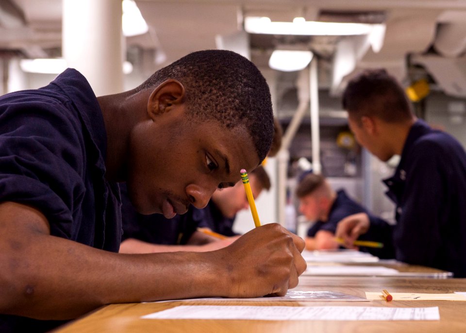 USS Fitzgerald Sailors take the E-4 advancement exam 160317-N-GW139-008