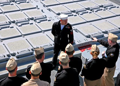 US Navy 060307-N-3532C-026 A Sailor assigned to the guided missile destroyer, USS Bunker Hill (CG 52) explains basic shipboard missile capabilities to a class of Naval Junior Reserve Officer Training Corps (NJROTC), students photo