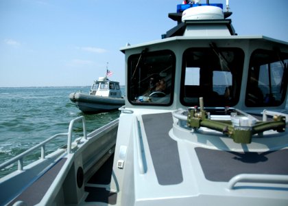 US Navy 060331-N-1464F-011 Naval Submarine Support Center harbor security, accompany the guided-missile submarine USS Florida (SSGN 728) into Naval Station Norfolk for a brief stop for passengers