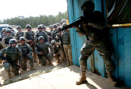 US Navy 060405-N-4097B-003 A Sailor demonstrates the proper techniques to conducting a search during the Navy's Individual Augmentee Combat Training course at Fort Jackson, S.C