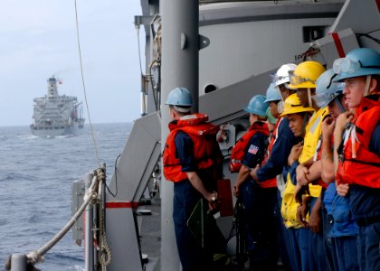 US Navy 060318-N-7526R-068 Amphibious command ship USS Blue Ridge (LCC 19) Sailors line the rails in preparation for a replenishment