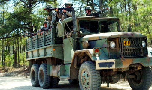 US Navy 060405-N-4097B-014 Sailors aim M-16A1s in the midst of a search of insurgents during the Navy's Individual Augmentee Combat Training in Fort Jackson, S.C