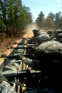 US Navy 060405-N-4097B-012 Sailors man their M-16A1s and sit a vigilant watch, as they conduct convoy exercises during the Navy's Individual Augmentee Combat Training course