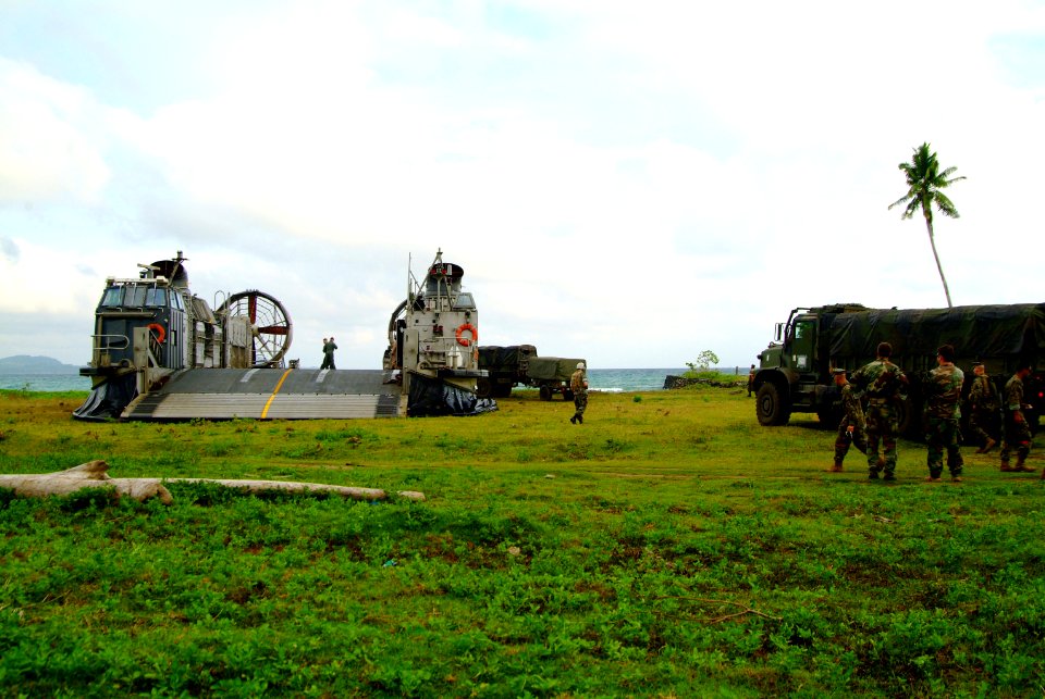 US Navy 060303-N-4772B-016 Marines assigned to the 31st Marine Service Support Group (MSSG) load equipment on a Landing Craft, Air Cushion (LCAC) on the island of Jolo, before heading out toward the amphibious dock landing ship