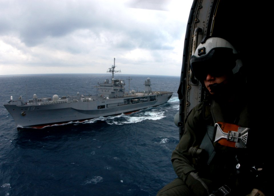 US Navy 060317-N-7526R-302 Aviation Warfare Systems Operator 3rd Class Karl Stiglbauer, assigned to the Warlords of Helicopter Anti-Submarine Squadron Light Five One (HSL-51), prepares to conduct various search and rescue (SAR)