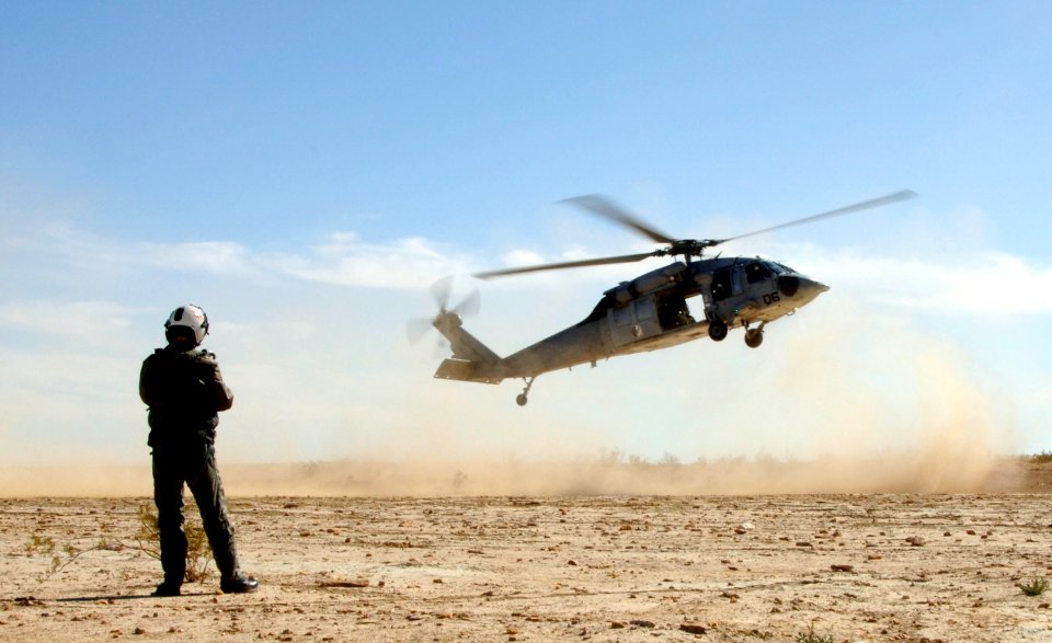 US Navy 060223-N-9500T-114 Photographer's Mate 1st Class Daniel Woods, assigned to Fleet Public Affairs Center, Pacific, documents a MH-60S Seahawk assigned to Helicopter Sea Combat Squadron Three