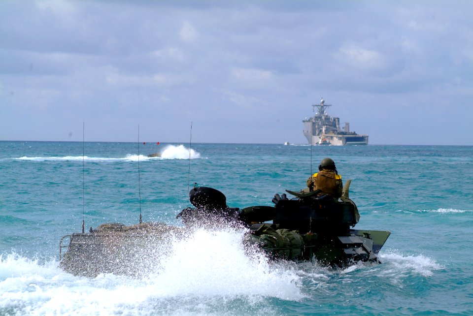 US Navy 060322-N-4772B-054 Amphibious Assault Vehicles (AAV) assigned to the 31st Marine Expeditionary Unit (MEU) approach the well deck of the amphibious dock landing ship USS Harpers Ferry (LSD 49)