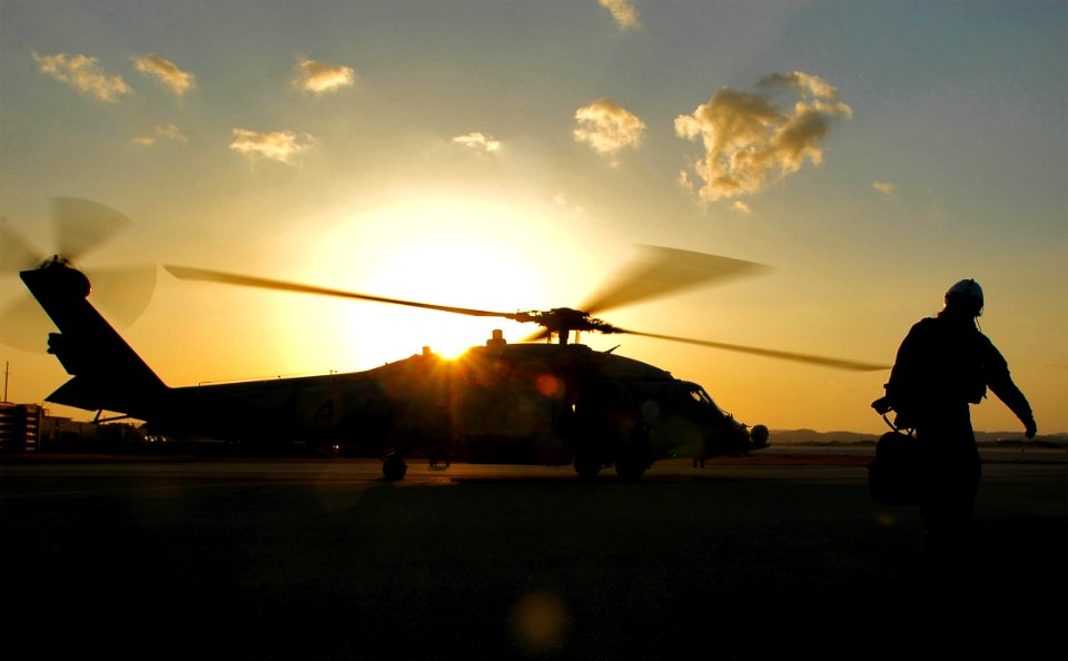 US Navy 060328-N-6074Y-106 Aviation Warfare Systems Operator 1st Class (NAC) Cory Merritt, an air crewman assigned to Helicopter Anti-Submarine Squadron Two (HS-2) Golden Falcons, makes his way back to the hangar