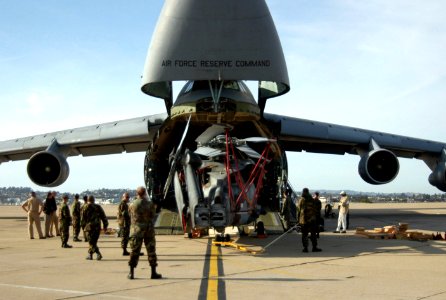 US Navy 060324-N-2832L-043 Sailors assigned to Helicopter Anti-Submarine Squadron Ten (HS-10), load two HH-60A Seahawk helicopters aboard an Air Force C-5 Galaxy photo