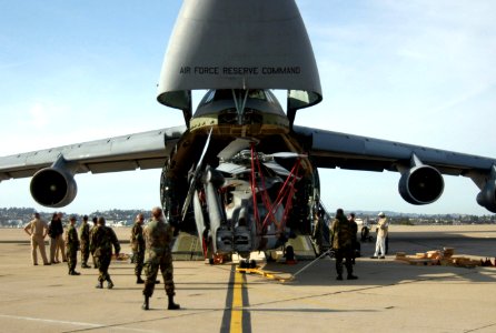 US Navy 060324-N-2832L-043 Sailors assigned to Helicopter Anti-Submarine Squadron Ten (HS-10), load two HH-60A Seahawk helicopters aboard an Air Force C-5 Galaxy