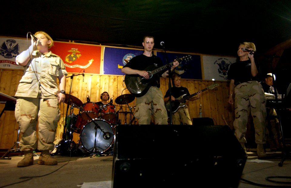 US Navy 060318-F-2902B-090 U.S. Navy Petty Officer 3rd Class Lisa Ramey left, performs with U.S. Air Force Heartland of America Band