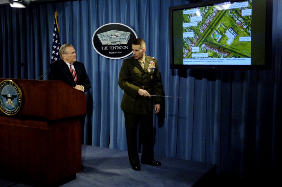 US Navy 060328-N-0696M-110 Chairman of the Joint Chiefs of Staff Marine Gen. Peter Pace shows reporters a diagram laying out a recent mission in Iraq during a Pentagon press briefing at the Pentagon