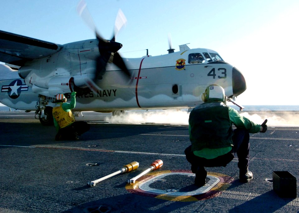 US Navy 060227-N-7359L-001 Sailors stationed aboard the Nimitz-class aircraft carrier USS Dwight D. Eisenhower (CVN 69) give a thumbs up as part of final checks for a C-2A Greyhound