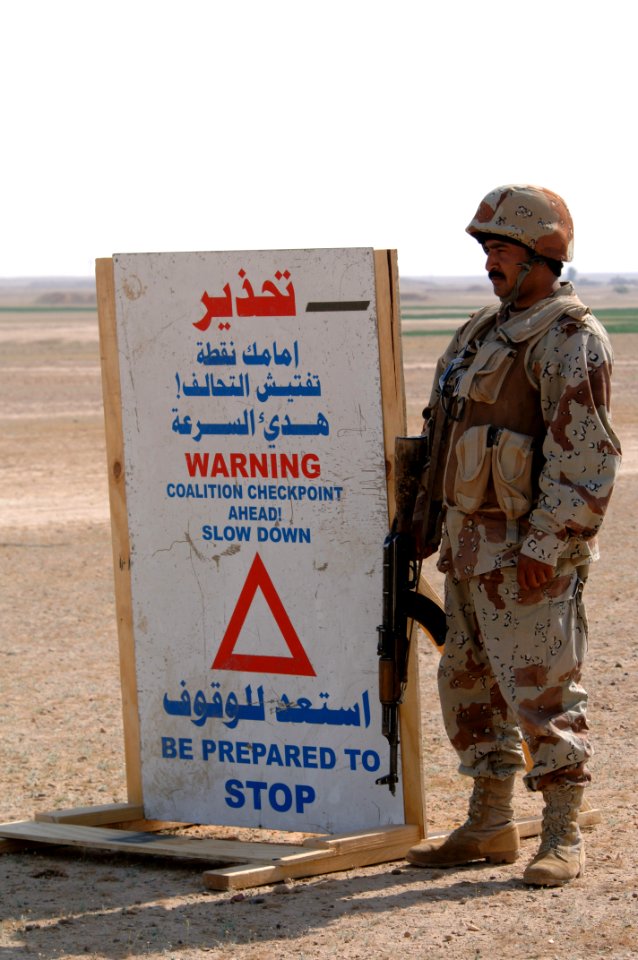 US Navy 060331-N-5438H-139 An Iraq Army soldier assigned to the 1st Battalion, 1st Brigade, 4th Division, mans a checkpoint during Operation Red Light II, on the outskirts of Monfia village in the Western Desert