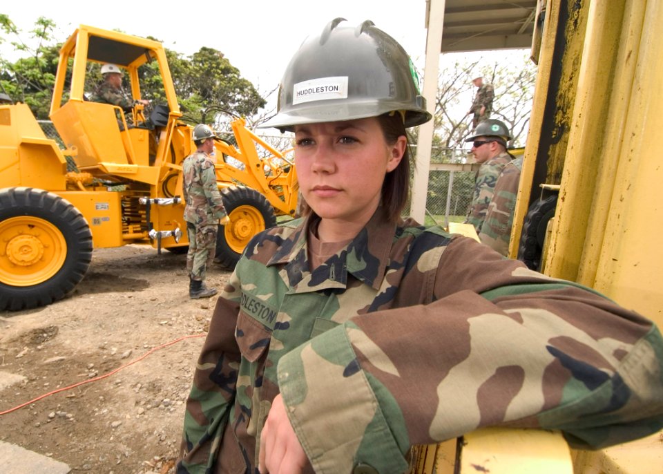 US Navy 060419-N-2385R-052 Equipment Operator Constructionman Apprentice Raymie Huddleston assigned to Naval Mobile Construction Battalion Four (NMCB-4), stands by on a project site
