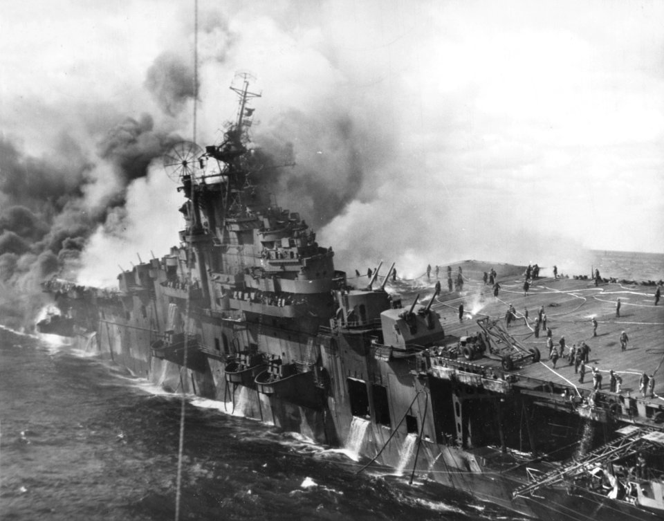 USS Franklin (CV-13) afire and listing after a Japanese air attack on 19 March 1945 (80-G-273882)