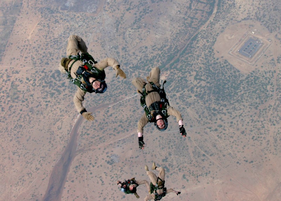 US Navy 060330-M-4657S-001 Force Reconnaissance Marines assigned to the 22nd Marine Expeditionary Unit (MEU) Special Operations Capable (SOC) freefall over Djibouti, during parachute training