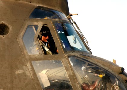 US Navy 060321-N-7526R-100 Commanding Officer USS Blue Ridge (LCC 19) Capt. Jeff Bartkoski, looks over the flight deck just before taking off in an Army CH-47 Chinook helicopter assigned to the 52nd Aviation Regiment from Camp