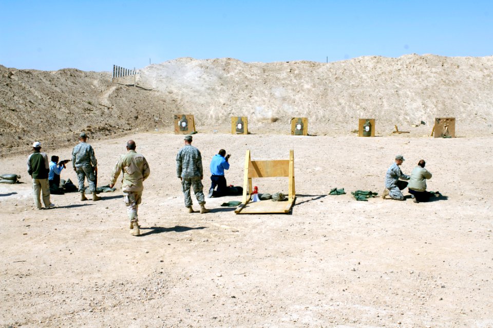 US Navy 060330-N-4614W-047 Iraqi Police officers from Tikrit's main element, fire AK-47 assault rifles, during weapons familiarization provided by U.S. Army Soldiers from 3rd Battalion, 187th Infantry Regiment