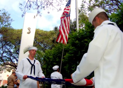 US Navy 060425-N-0879R-001 Sailors assigned to Submarine Force, U.S. Pacific Fleet raise U.S. flags over the World War II Submarine Memorial at Pearl Harbor, Hawaii