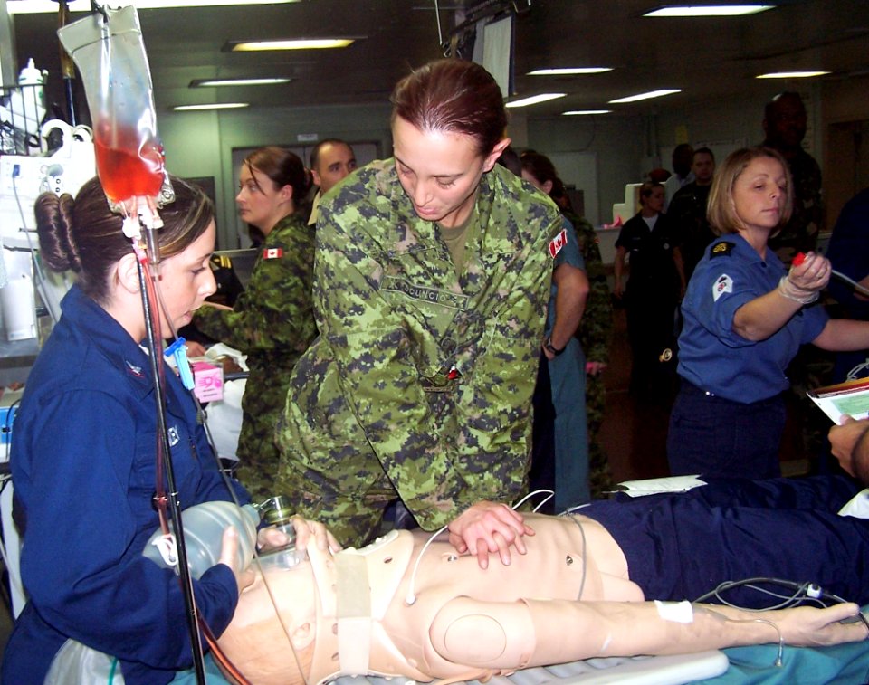US Navy 060428-N-0780W-001 Canadian Forces Cpl. Connie Scuncio, performs CPR on a mannequin during a mass casualty exercise aboard the Military Sealift Command (MSC) hospital ship USNS Comfort (T-AH 20) as Hospital Corpsman 3rd
